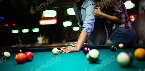 Preview: Couple dating, flirting and playing billiard in a pub