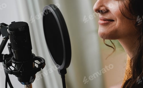 Preview: Singer recording song for new album inside music production studio - Happy woman doing radio podcast