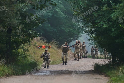 Preview: Elite military unit parading and securing the forest, utilizing drones for terrain scanning and