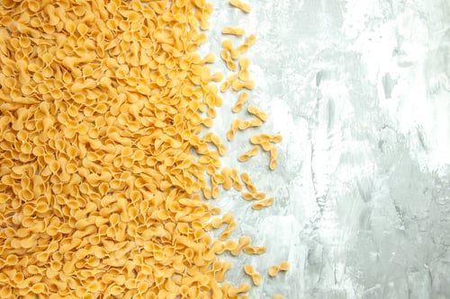 Preview: top view little raw pasta on a light background meal many dough photo food color
