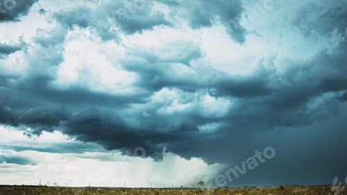 Preview: Storm Cloudy Rainy Sky. Dramatic Sky With Dark Clouds In Rainy Day. Storm And Rain Above Summer