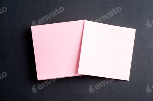 Preview: Overhead view of pink envelopes on isolated black background with free space