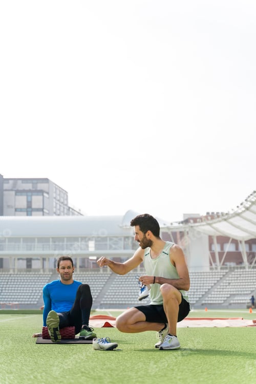 Preview: Athletes Stretching in Athletic Track