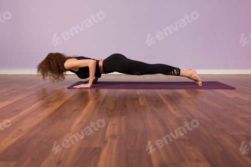 Preview: healthy sports woman doing yoga indoors at gym club