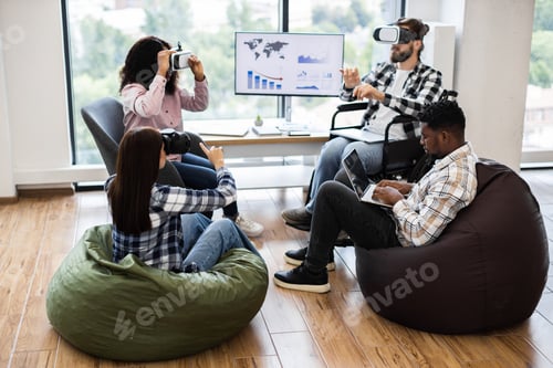 Preview: Diverse team exploring virtual reality technology in modern office setting