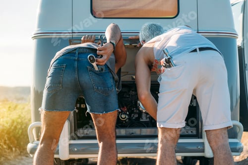 Preview: Anonymous men repairing van