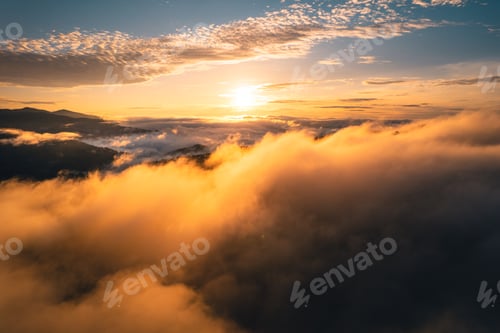 Preview: The sun rises in the mist and mountains in the morning