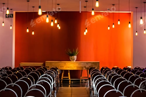Preview: Hall with a beautiful interior with a lot of lamps hanging from the ceiling and empty chairs