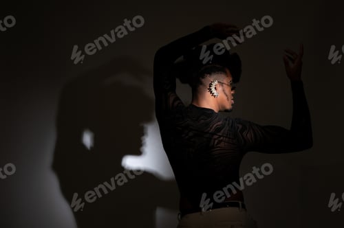 Preview: Young dancer performing with shadow on wall