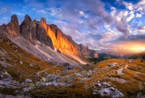 Preview: Landscape with mountain peaks, rocks, alpine meadows at sunset