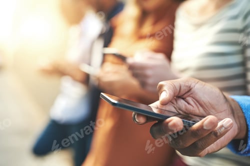 Preview: Shot of an unrecognizable group of people social networking outside