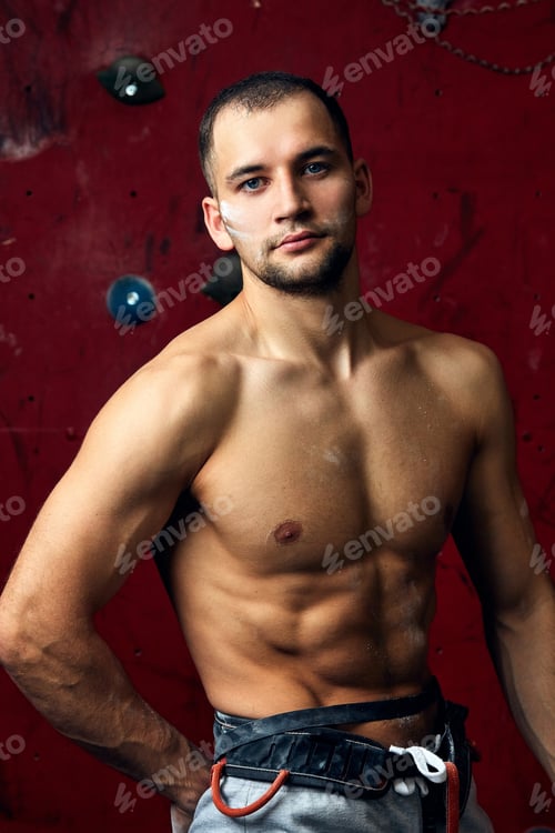 Preview: Closeup portrait of rock climber against artificial wall for climbing