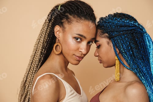 Preview: Young black two women with afro pigtails posing with head to head