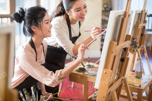 Preview: Young women painting in studio
