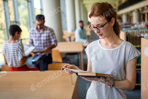 Preview: Education friendship people concept. Group of happy students learning together in college library