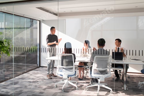 Preview: Chinese business people having meeting in board room