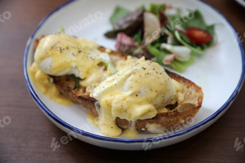 Preview: Egg Benedict , Poached Eggs With Toast On Wood Background , English Breakfast