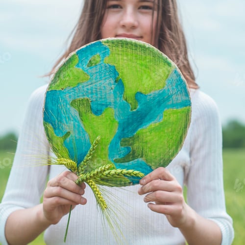 Preview: girl holding drawn planet in hands