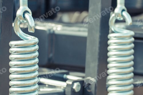 Preview: Hard silver spring made of steel. Part of big industrial or agricultural machine