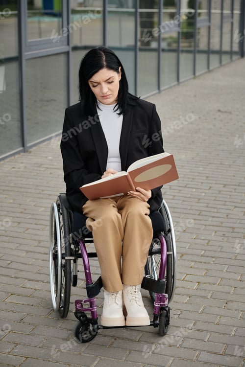 Preview: Woman Reading in a Wheelchair