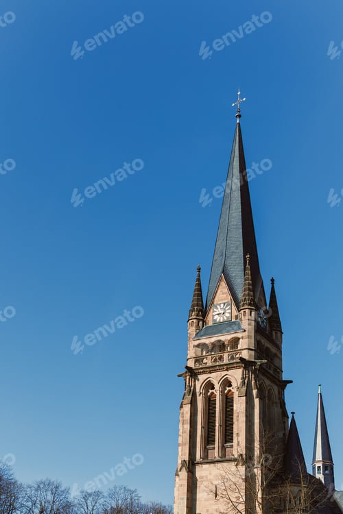 Preview: Ancient city buildings. Ancient brick church. Catholic cathedral made of stone.