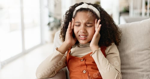 Preview: Young girl, headache and sofa with stress in anxiety, depression or loneliness at home. Little fema