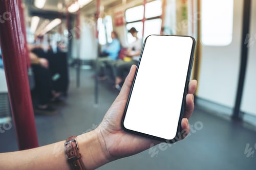 Preview: Mockup image of woman's hands holding black mobile phone with blank screen in subway