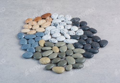 Preview: Colorful decorative stones for crafting on concrete background