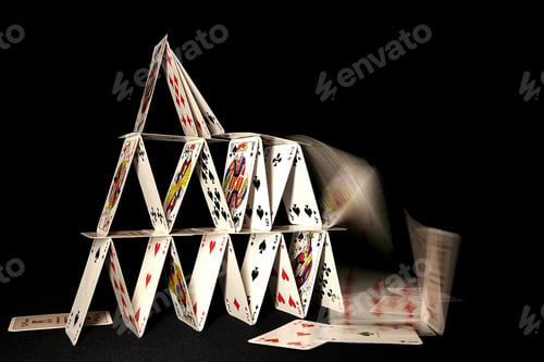 Preview: House of cards collapsing on dark backgroun