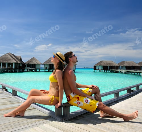 Preview: Couple On A Tropical Beach Jetty At Maldives