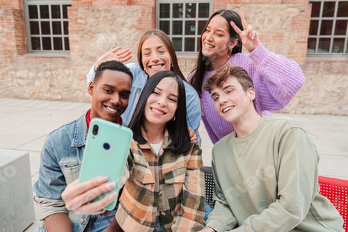 Preview: A Delightful Group of Friends Enjoying a Lighthearted Moment While Taking a Fun Selfie, Showcasing