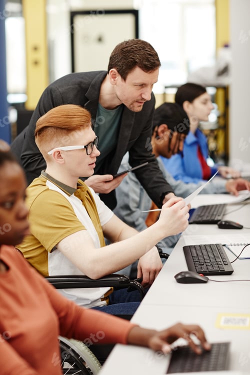 Preview: Teacher Helping Students in Computer Lab