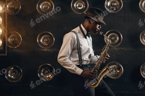 Preview: Man Plays Saxophone in Dramatic Lighting