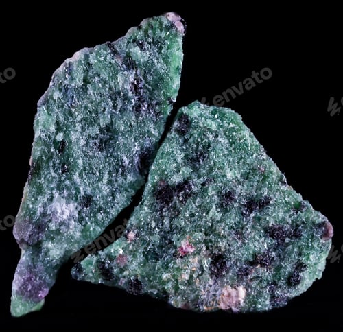 Preview: Closeup of zoisite blue and green gemstone isolated on a black background