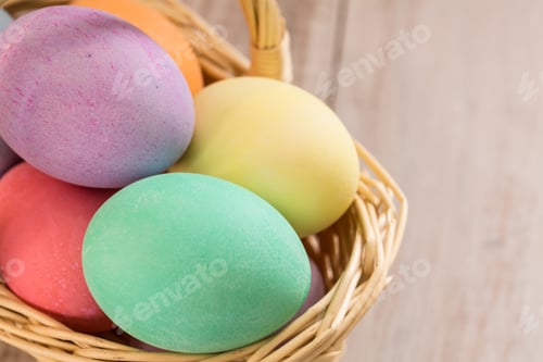 Preview: Close Up Of Colored Easter Eggs In A Wicker Basket