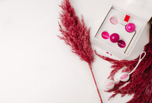 Preview: Kegel balls (Ben Wa balls) on white background, for woman sensuality, vaginal balls, overhead view