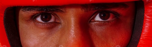Preview: Close up of sporty man wearing protective head guard for boxing