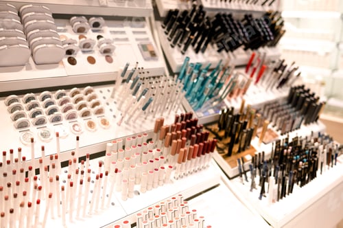 Preview: Shelves with makeup products in a cosmetics store indoor