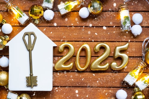 Preview: House key with tiny figure of home mock up on festive brown wooden background, lights of garlands. N