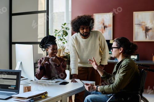 Preview: Two colleagues looking at AI designer