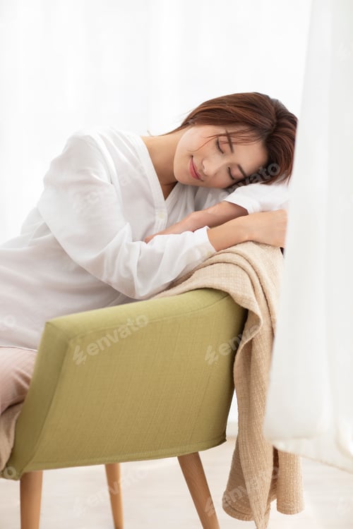 Preview: Young Chinese woman resting at home