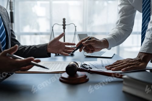 Preview: Attorneys or lawyer reading statute of limitations, consulting between male lawyers and business cli