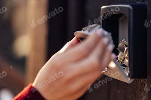 Preview: Close-Up of a Hand Retrieving Keys From a Secure Lockbox