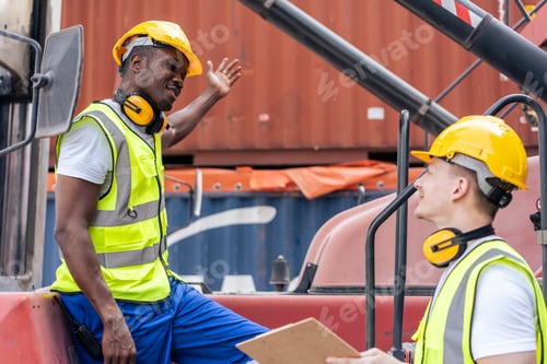Preview: African American and Caucasian man worker work in container terminal.