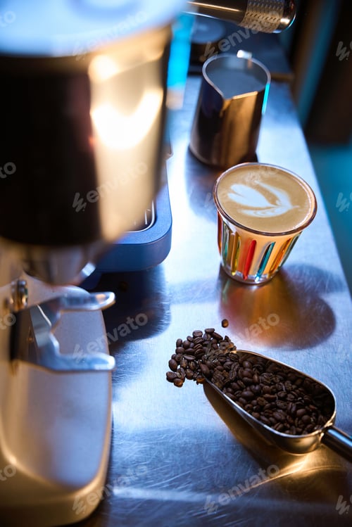 Preview: Coffee beans in scoop cup of coffee and coffee machine