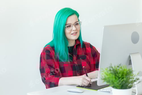 Preview: Graphic designer, animator and illustrator concept - young woman with green hair working at the