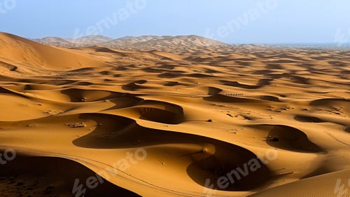 Preview: Camel Caravan Crossing Vast Golden Dunes at Sunrise in Moroccan Sahara