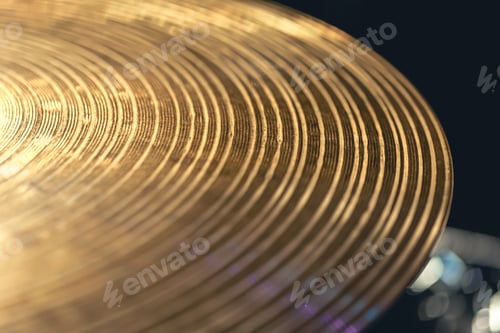 Preview: Drum cymbal close-up on a dark background.