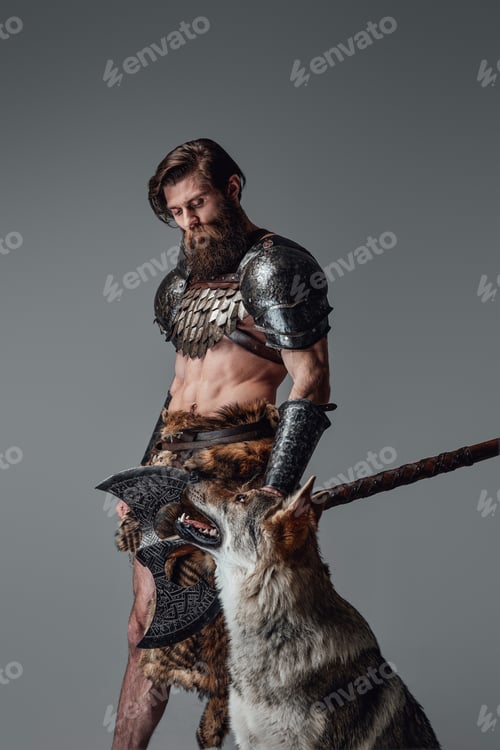 Preview: Mythical nordic barbarian armed with axe posing with wild wolf