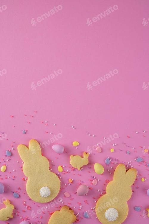 Preview: Easter food background with bunny and carrot-shaped cookies and sweets. Top view, copy space.